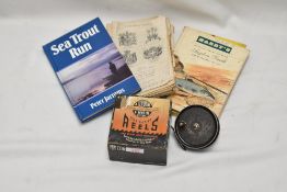 A small group of fishing books including Hardy Anglers guide and A J W Young 3.5 inch Condex fly