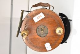 A Vintage wood and brass reel measuring 14cm diameter