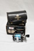 An Abu Ambassadeur 6000c in leather case and boxed with instructions