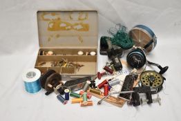 A selection of vintage fishing tackle including fly reels,spinning reels, lures and flies, A fly