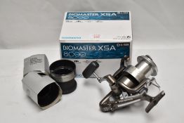A Shimano Biomaster XSA 8000 new and boxed with 2 spare spools in box
