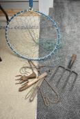 A Large landing net some net repairing tools and some vintage poaching equipment
