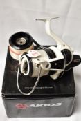 An AKIOS Scora 100 fixed spool reel boxed with spare spool