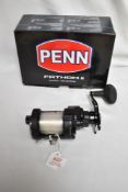 A Penn Fantom II casting special FTH 11DCS reel in box with instructions