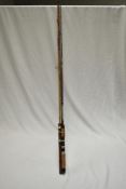 Three vintage fishing rods of varying length