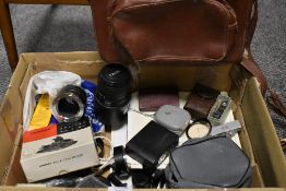 A box of various camera and photographic items including Sigma zoom 55-200mm 1:4-5,6 DC lens,