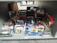 A shelf of modern diecasts, including Saico, Maisto, Funtastic and similar all boxed approx 70+