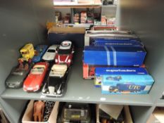 A shelf of modern diecasts including 12 Corgi Superhaulers and similar boxed diecasts, 1:18 scale
