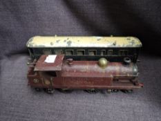 A Hornby 0 gauge clockwork 4-4-4 LMS Tank Locomotive 2052 in traditional maroon livery along with