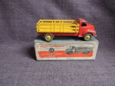 A Dinky diecast, 531 Leyland Comet Lorry having yellow body, red cab and chassis, in original blue