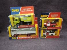 Four Dinky diecasts, 442 Land Rover Breakdown Vehicle x2 in white & red and red & white, 449