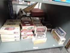 A shelf of diecast 1:50 and 1:76 scale Buses, Corgi Classics x 11, EFE x 3, Oxford x 11, Atlas x 9