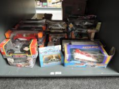A shelf of mixed scale diecasts including 1:24 Motor Max, Ford Motor Company Lincoln Limousine 1996,