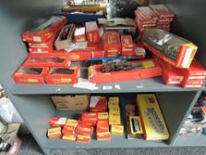 Two shelves of Triang Hornby 00 gauge including R251 0-6-0 Loco & Tender 3775, 4-2-2 Lord of Isles