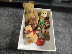 A mid 20th century straw filled yellow plush Teddy Bear having plastic eyes, stitch nose and