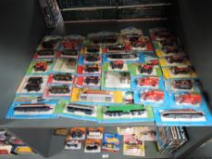 A shelf of ERTL Britt Thomas The Tank Engine and similar Accessories, approx 36, all on bubble