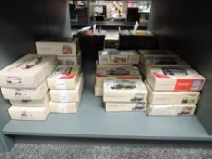 A shelf of Modern Corgi Classics diecast Buses, approx 26, all boxed