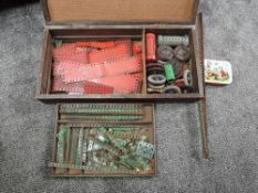 A home made wooden box of 1950's Meccano, parts, wheels, cogs etc