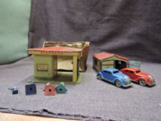 A Marke Lehmann DRGM GNOM tin plate Garage containing two nr 807 Cars, one blue and one ed along