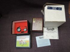 A Britains diecast, 8711 Ferguson TE20 Tractor in original box with wooden plinth