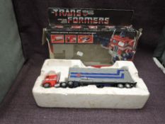 A 1984 Hasbro Bradley Transformers Autobot Commander Optimus Prime, in inner packaging with