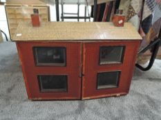 A vintage two storey Dolls House having four rooms and single staircase containing a small amount of