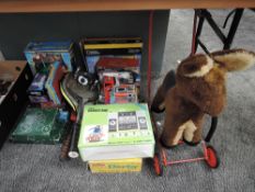 A collection of mixed Toys including Push Along Horse, Adman Grandstand, Merit Electric Derby, etc