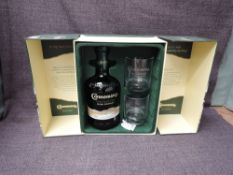 A bottle of Connemara Peated Single Malt Irish Whiskey, 70cl, 40% vol with two glasses in card