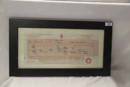 A 50cm by 27cm John Winston Lennon facsimile framed birth certificate
