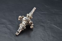A George V silver babies rattle/whistle, of hexagonal section with large central 'knop' suspending