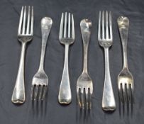 A harlequin set of six George III Hanoverian pattern forks, each engraved with dog and crown