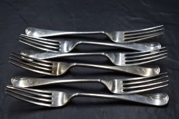A group of six George V silver Old English pattern table forks, with pip to terminal and engraved