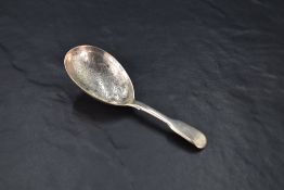 A Victorian silver fiddle pattern caddy spoon, the oval bowl with foliate bright-cut engraving,