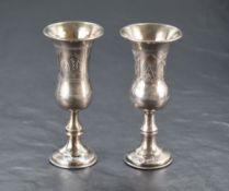 A George V silver Kiddush cup, of traditional elongated bell form with wrigglework engraving and