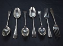 A group of four late Victorian silver Old English pattern teaspoons engraved with initials J&AD,