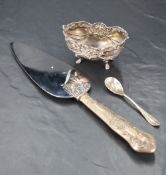 A late Victorian silver bowl, of dished oval form embossed with foliate scrolls and swags, marks for