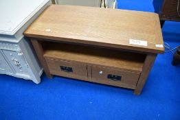 A modern golden oak effect TV stand