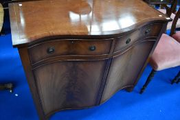 A reproduction Regency serpentine front narrow sideboard, width approx. 100cm