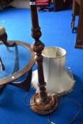 A traditional standard lamp having classical style column