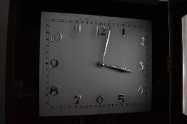 A 1920s design walnut long case clock