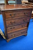A reproduction Regency TV cabinet, modelled as faux chest