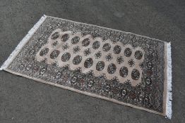 A traditional fireside rug, approx 160 x 95cm