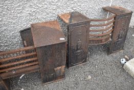 Two vintage cast iron fire grates
