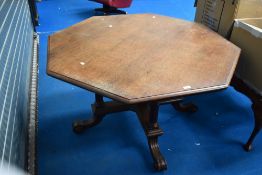 A Victorian oak dining table having octagonal top on quatrefoil base, bought from the clearance sale