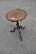 An early 20th Century reproduction mahogany wine table