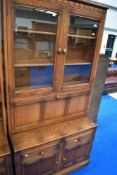 A modern Ercol mid stain display/cocktail unit