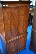 A reproduction Regency style yew wood cocktail cabinet