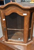 A small vintage corner wall unit