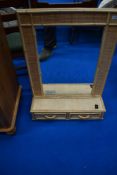 A bamboo boudoir wall mirror