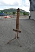 A traditional artist easel of large proportions